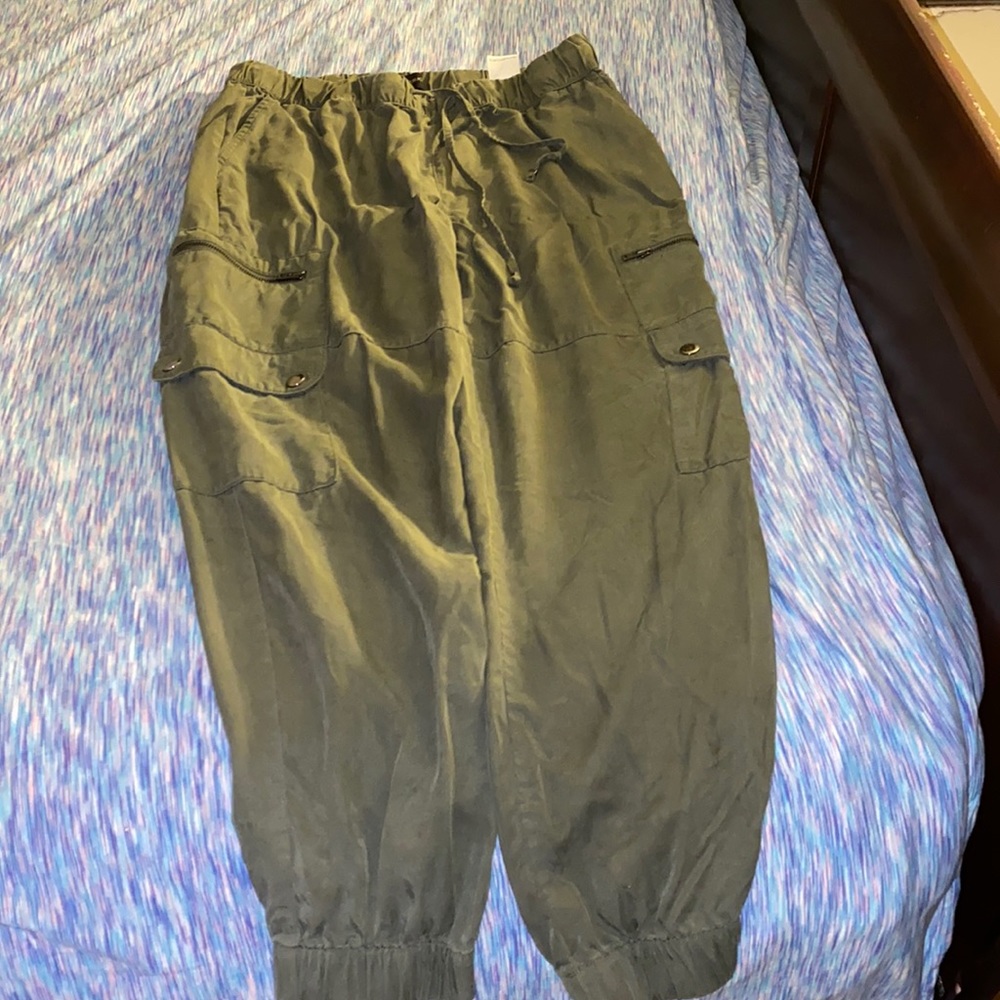 A pair of dress dark green dress pants